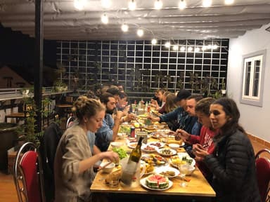 Guests having dinner on the rooftop at Mooka's Home