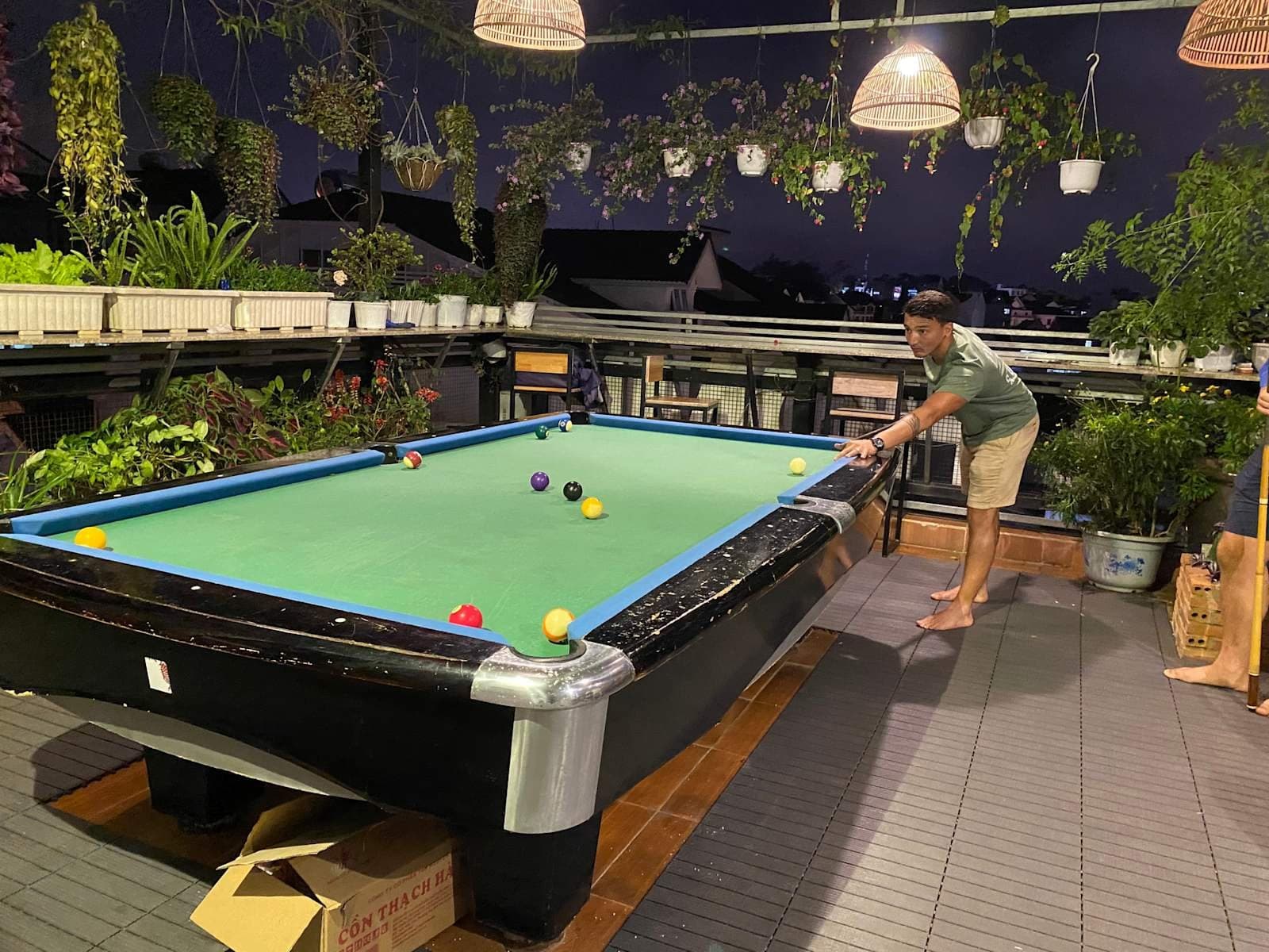 Pool table on the rooftop of Mooka's Home with city view