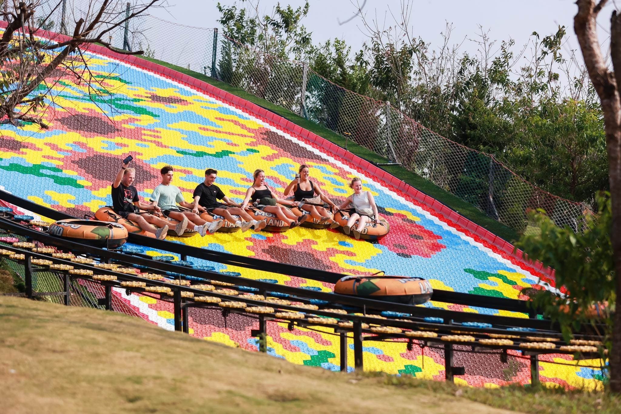Guests on the rainbow slide at Mongo Land, Da Lat